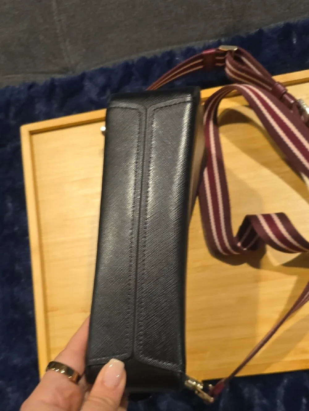 kate spade Lauryn black leather camera bag with burgundy striped strap